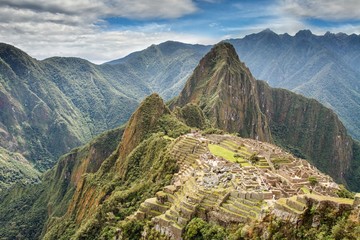 View of the Lost Incan City of Machu Picchu near Cusco, Peru. Machu Picchu is a Peruvian Historical Sanctuary and a UNESCO World Heritage Site. Machu Picchu is located in the Cusco Region in Peru.
