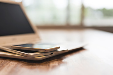 phone and tablet on a laptop