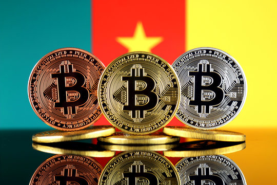 Physical version of Bitcoin (BTC) and Cameroon Flag. Conceptual image for investors in High Technology (Cryptocurrency, Blockchain Technology, Smart Contracts, ICO).