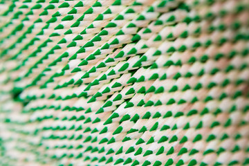 Green pencil warehouse. Drawing artist supplies. Background pattern texture