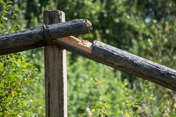 Broken old wooden electric pole