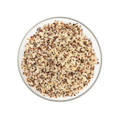 Cooked mixed quinoa seeds in a round glass bowl seen directly from above and isolated on white background