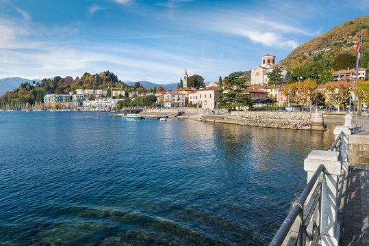 Beautiful small town on a large Italian lake. Lake Maggiore and the most characteristic area of Laveno with the lakeside promenade, the old harbor (on the right) and the new one (on the left)