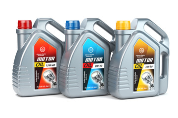 Plastic motor oil canisters with different types of motor oil on white isolated background.
