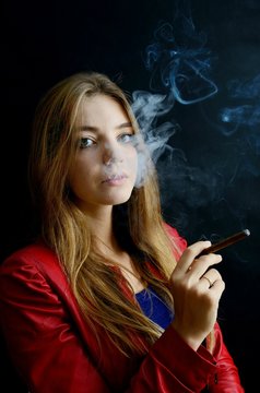 Young female smoking cigarillo