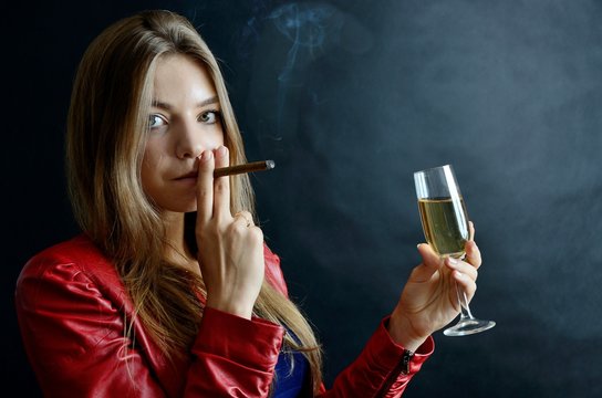 Young female with cigarillo and white wine