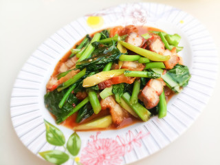 Stir fried kale with crispy pork / Thai Food is delicious
