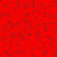 Seamless pattern with red mittens, socks, hats and evergreen branches on bright red background