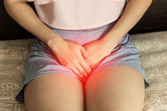 woman have bladder or uti pain sitting on bed in bedroom after wake up feeling so illness,Healthcare concept