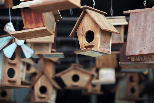 close up of hanging small wooden bird house