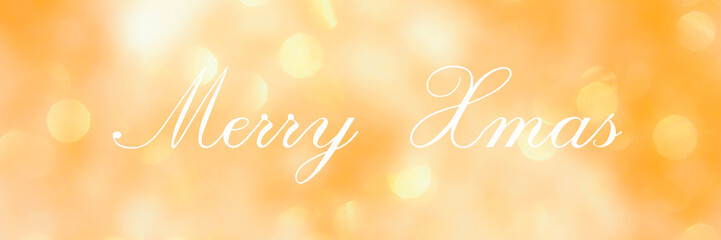 Merry Xmas, lettering on golden blurred background of lights