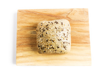 Bread with flax seeds, oats and sesame on a wooden board

