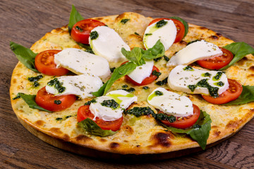 Pizza Caprese with basil