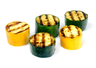 green and yellow zucchini on a grill