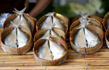 Mackerel steamed in woven bamboo for sale at the market