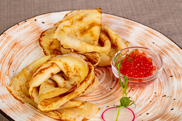 Russian pancakes with red caviar