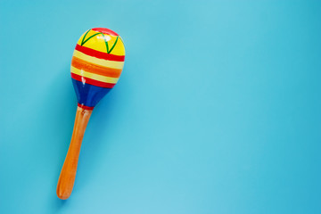 Maracas on blue background for baby toy musical instrument, hobbies, learning and education concept