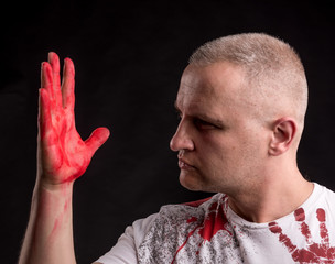 Portrait of  man with bloody hand © vbaleha