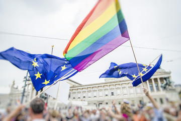 people waving rainbow and European union   flag. Celebrating  rainbow parade  day 