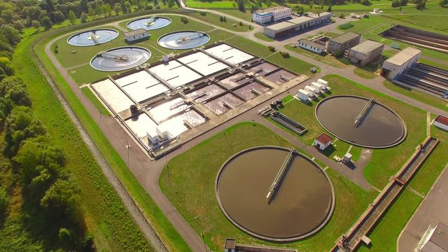 Aerial view to sewage treatment plant. Grey water recycling. Waste management theme. 