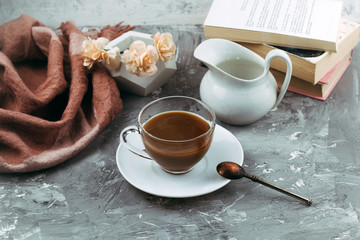 still life with cup of drink and books