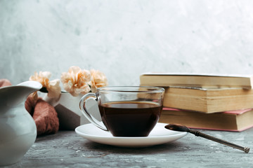 still life with cup of drink and books