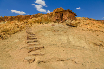 Abandoned houses built in the rock on the Calico mountains in Calico. Calico is a ghost town and former Mining in the Mojave Desert region of Southern California, United States.