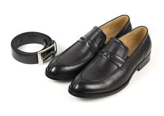 The black man's shoes and accessories isolated on white and black background.