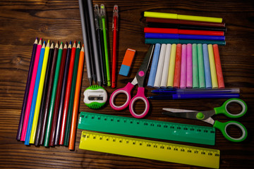 Set of school stationery supplies on wooden desk. Back to school concept