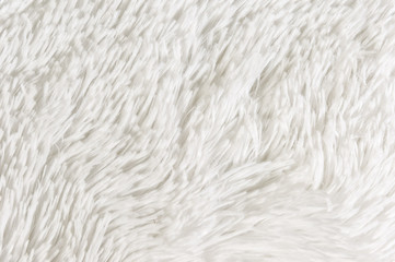 Fluffy plaid of polyester with a long heap gray. Comfortable home textiles. Background, texture