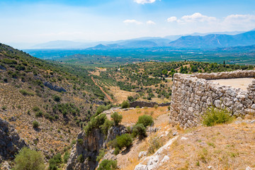 Fototapeta na wymiar View of the mainland below from the Mycenean palace. Archaeological site of Mycenae in Peloponnese Greece