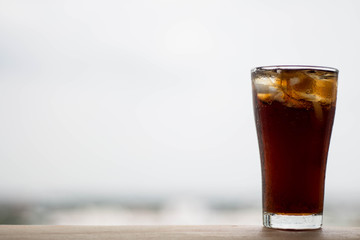 Glass of Cola drink with ice, Space