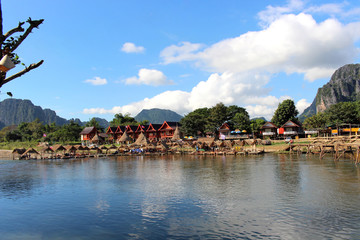 Fototapeta premium Vang Vieng, Laos - January 1, 2016 : Travel Song River, The river clear and mountain view beautiful and blue sky