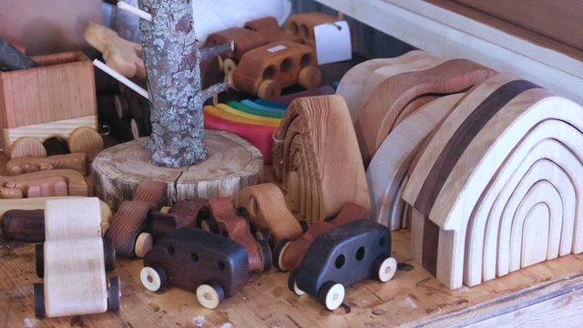 Wooden toys on the table in workshop.