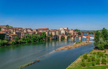 Fototapeta na wymiar Albi cityscape with Tarn river, medieval bridge and blue sky, Tarn, France