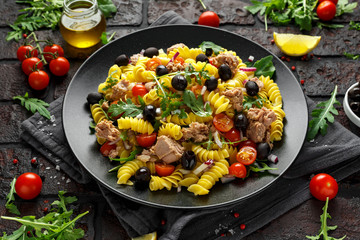 Pasta Tuna salad with tomatoes, wild rocket, black olives and red onion
