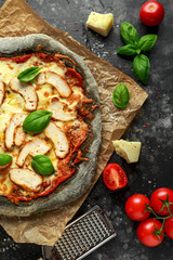 Stone Baked Black Pizza with chicken, tomato and mozzarella cheese