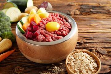 Wholesome meal for a pet dog with raw meat