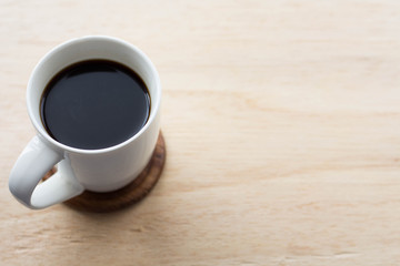 cup of coffee on wooden table