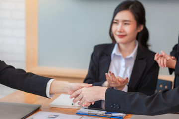 Businesswoman shaking hands. Congratulations and success of the business at meeting