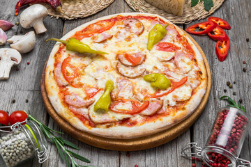 Pizza with tomatoes, mozzarella cheese. Delicious italian pizza