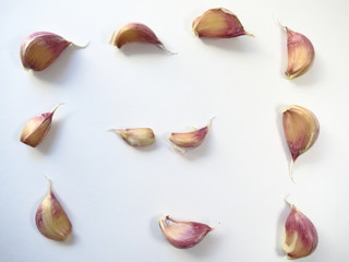 Garlic cloves on white background close-up