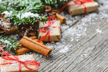 Christmas gift boxes, present with red ribbon, festive xmas background, holiday composition on wood