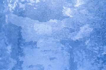 Fototapeta na wymiar Frosty pattern similar to brickwork on winter window. 