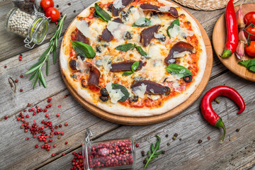 Pizza with tomatoes, mozzarella cheese. Delicious italian pizza