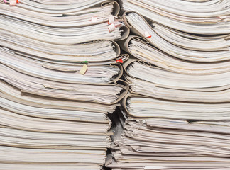 Old paper documents stacked in archive. Documents on the shelves of archive room. Office shelves in the closet full of files