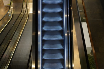 Illuminated escalator in a shopping mall