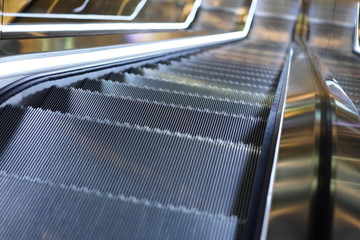 Illuminated escalator in a shopping mall