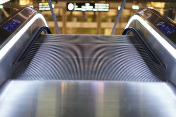 Illuminated escalator in a shopping mall