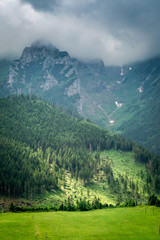 Cloudy Tatra Mountains with an illuminated green valley, Slovakia